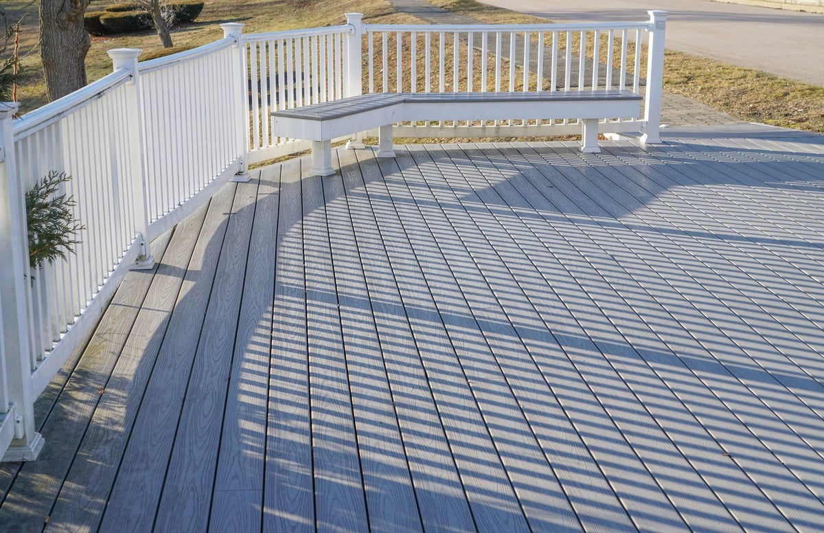 Close-up of a freshly stained and sealed wooden deck surface